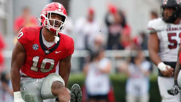 Georgia linebacker Jamon Dumas-Johnson (10) celebrates after stopping South Carolina quarterback Spencer Rattler (7) during the second half of a NCAA college football game against South Carolina in Athens, Ga., on Saturday, Sept. 16, 2023. Georgia won 24-14.  
