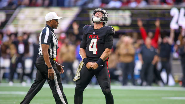 Nov 5, 2023; Atlanta, Georgia, USA; Atlanta Falcons quarterback Taylor Heinicke (4) reacts after a touchdown against the Minnesota Vikings in the second half at Mercedes-Benz Stadium.