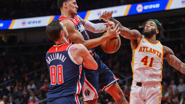 Nov 1, 2023; Atlanta, Georgia, USA; Washington Wizards guard Johnny Davis (1) grabs a rebound past Atlanta Hawks forward Saddiq Bey (41) in the second quarter at State Farm Arena. Mandatory Credit: Brett Davis-USA TODAY Sports