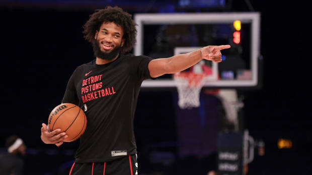 Marvin Bagley III smiles and points on the court during warmups