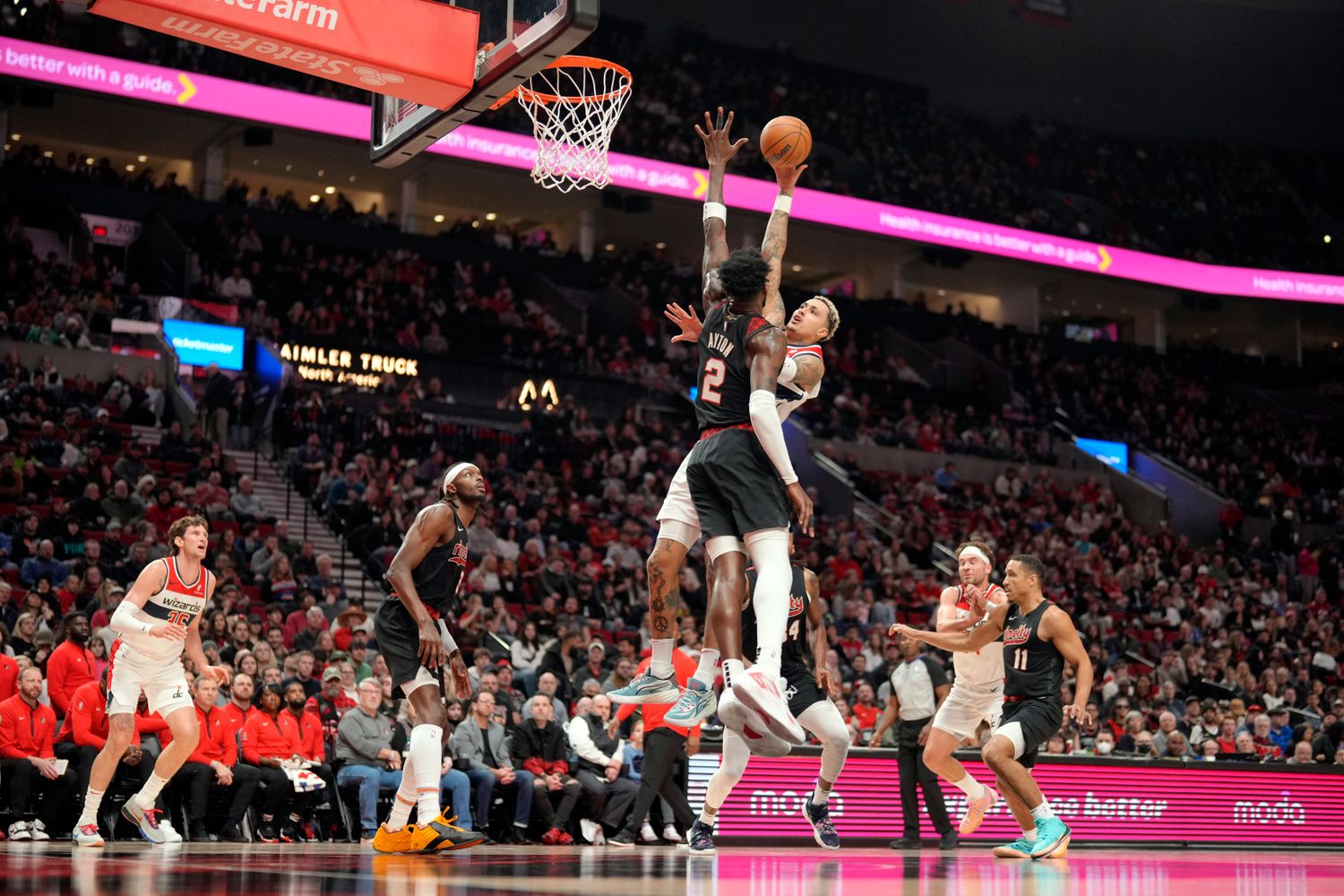 Dec 21, 2023; Portland, Oregon, USA; Washington Wizards small forward Kyle Kuzma (33, behind) shoots the ball over Portland Trail Blazers center Deandre Anton (2) during the first half at Moda Center. Mandatory Credit: Soobum Im-USA TODAY Sports