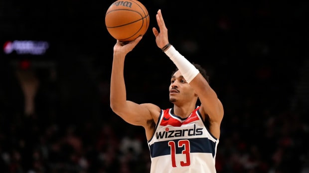 Dec 21, 2023; Portland, Oregon, USA; Washington Wizards shooting guard Jordan Poole (13) shoots the ball during the first half against the Portland Trail Blazers at Moda Center. Mandatory Credit: Soobum Im-USA TODAY Sports