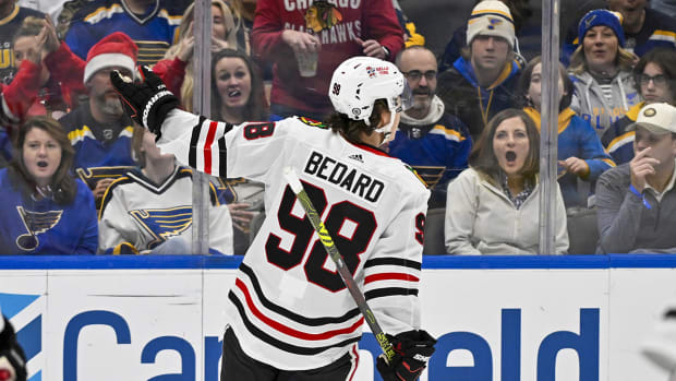 Connor Bedard reacts after scoring against the Blues.