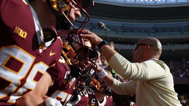 P.J. Fleck and Gophers players