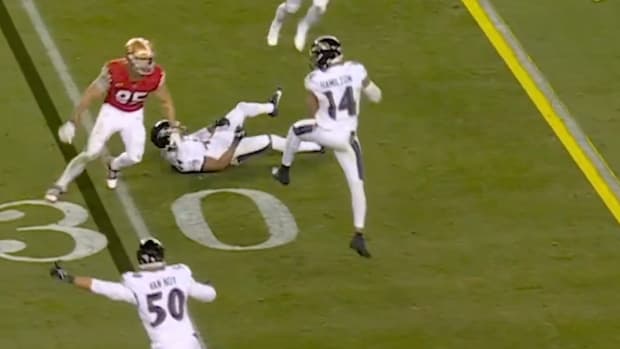 Baltimore Ravens safety Kyle Hamilton gets his second interception against the San Francisco 49ers in a Dec. 25, 2023 game.