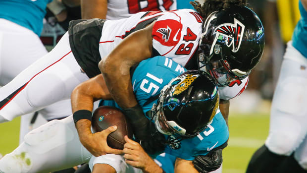 Aug 29, 2019; Jacksonville, FL, USA; Jacksonville Jaguars quarterback Gardner Minshew (15) is sacked by Atlanta Falcons linebacker Tre' Crawford (49) during the second quarter at TIAA Bank Field. Mandatory Credit: Reinhold Matay-USA TODAY Sports  