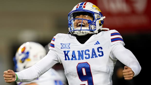 Kansas Jayhawks quarterback Jason Bean (9) celebrates a touchdown during the NCAA college football game between the Cincinnati Bearcats and Kansas Jayhawks on Saturday, Nov. 25, 2023, at Nippert Stadium in Cincinnati. Kansas won 49-16.  