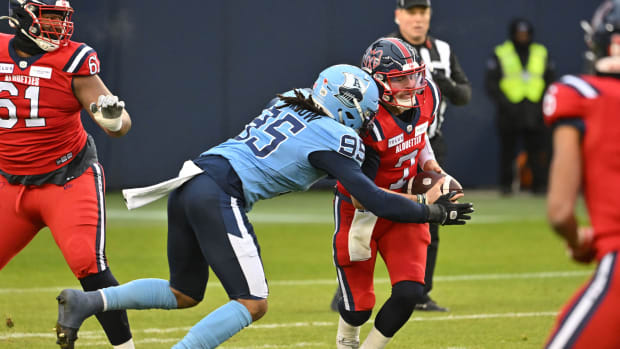 Nov 11, 2023; Toronto, Ontario, CAN; Toronto Argonauts linebacker Brandon Barlow (95) sacks Montreal Alouettes quarterback Cody Fajardo (7) in the first half at BMO Field. Mandatory Credit: Dan Hamilton-USA TODAY Sports  
