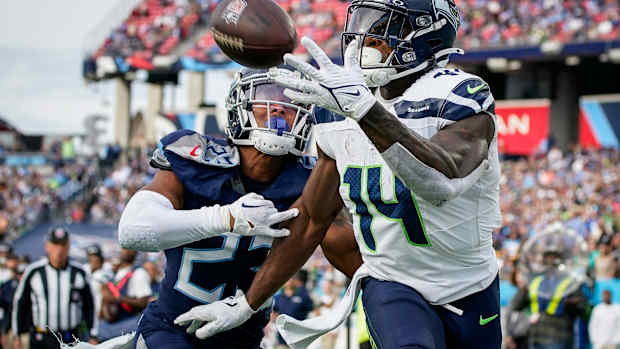 Seattle Seahawks wide receiver DK Metcalf (14) pulls in a touchdown past Tennessee Titans cornerback Tre Avery (23) during the fourth quarter at Nissan Stadium in Nashville, Tenn.,