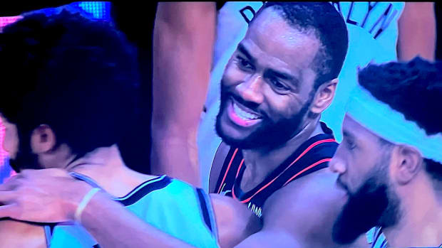 Detroit Pistons guard Alec Burks congratulates Brooklyn Nets players following a Dec. 26, 2023 game.
