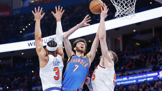 Dec 27, 2023; Oklahoma City, Oklahoma, USA; Oklahoma City Thunder forward Chet Holmgren (7) shoots between New York Knicks guard Josh Hart (3) and center Isaiah Hartenstein (55) during the second half at Paycom Center. 