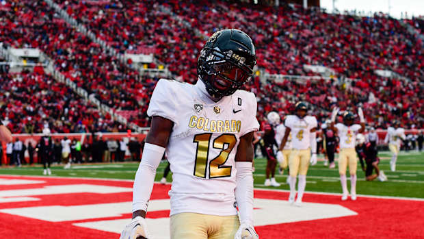 Nov 25, 2023; Salt Lake City, Utah, USA; Colorado Buffaloes athlete Travis Hunter (12) reacts after scoring a touchdown against the Utah Utes at Rice-Eccles Stadium.