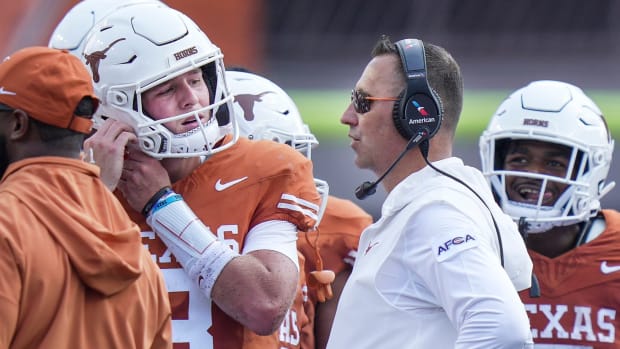 Texas Longhorns head coach Steve Sarkisian talks with Texas Longhorns quarterback Quinn Ewers (3) during a timeout in the first half of an NCAA college football game, Saturday, Sept. 2, 2023, in Austin, Texas.