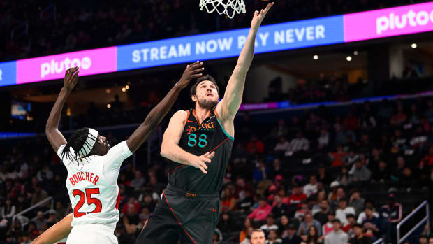 Dec 27, 2023; Washington, District of Columbia, USA; Washington Wizards forward Danilo Gallinari (88) shoots over Toronto Raptors forward Chris Boucher (25) during the first half at Capital One Arena. Mandatory Credit: Brad Mills-USA TODAY Sports