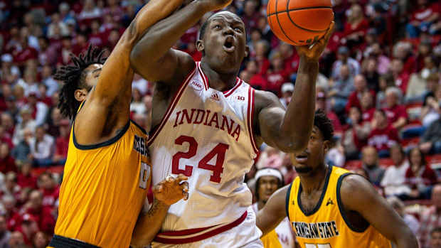 Indiana's Payton Sparks (24) shoots past Kennesaw State's Demond Robinson (0) during the first half of the Indiana versus Kennesaw State men's basketball game at Simon Skjodt Assembly Hall on Friday, Dec. 29, 2023.