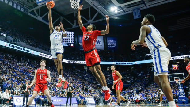 Kentucky Wildcats guard D.J. Wagner (21) scores twio of his 14 points in the first half as the Wildcats rolled past Illinois State 96-70 at Rupp Arena Friday night in Lexington, Ky. Dec. 29, 2023