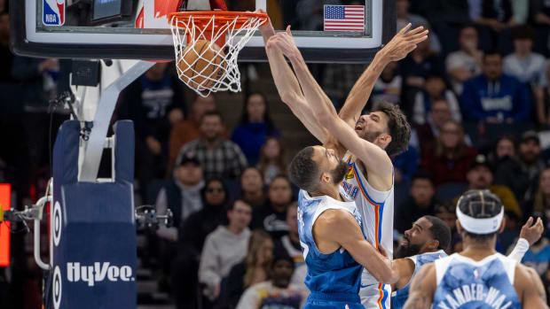 Nov 28, 2023; Minneapolis, Minnesota, USA; Oklahoma City Thunder forward Chet Holmgren (7) dunks over Minnesota Timberwolves center Rudy Gobert (27) in the second half at Target Center. Mandatory Credit: Jesse Johnson-USA TODAY Sports