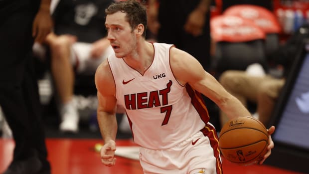 Heat point guard Goran Dragic dribbles a ball in a game.