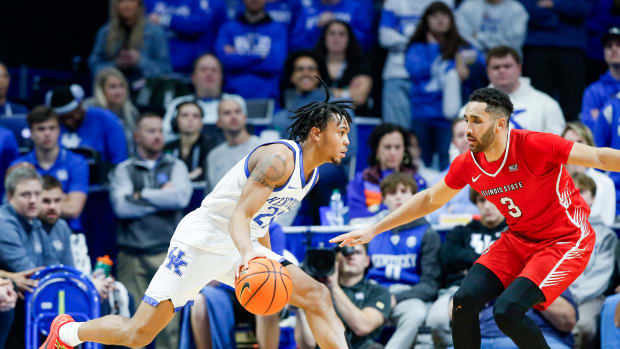 Kentucky Wildcats guard D.J. Wagner (21) looks to drive on Illinois State Redbirds guard Dalton Banks (3) in the second half Friday in the Wildcats' win over the Redbirds. Dec. 29, 2023