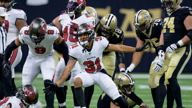 Oct 1, 2023; New Orleans, Louisiana, USA; Tampa Bay Buccaneers safety Antoine Winfield Jr. (31) celebrates a sack of New Orleans Saints quarterback Derek Carr (4) during the second quarter at the Caesars Superdome. Mandatory Credit: Matthew Hinton-USA TODAY Sports