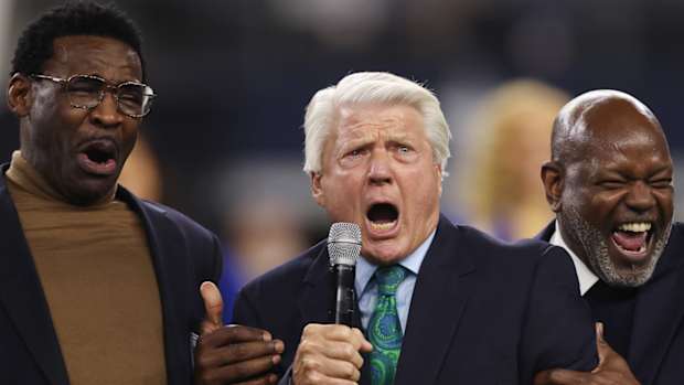 Cowboys Michael Irvin and Emmitt Smith flank former coach Jimmy Johnson