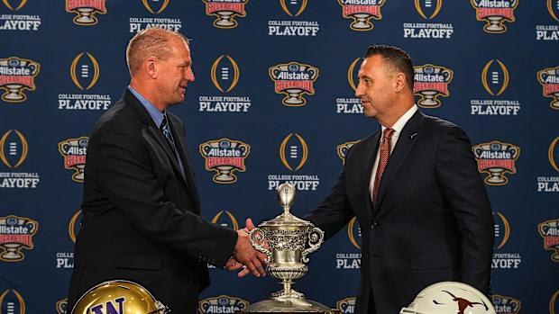 Washinton Huskies head coach Kalen DeBoer, left, meets Texas Longhorns head coach Steve Sarkisian, right, at the head coaches' press conference at the Sheraton hotel on Sunday, Dec. 31, 2023 in New Orleans, Louisiana. The Washington Huskies will take on the Texas longhorns in the College Football Playoff Semi-Finals on January 1, 2024.