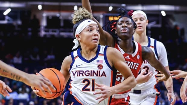 Kymora Johnson drives to the basket during the Virginia women's basketball game against NC State at John Paul Jones Arena.