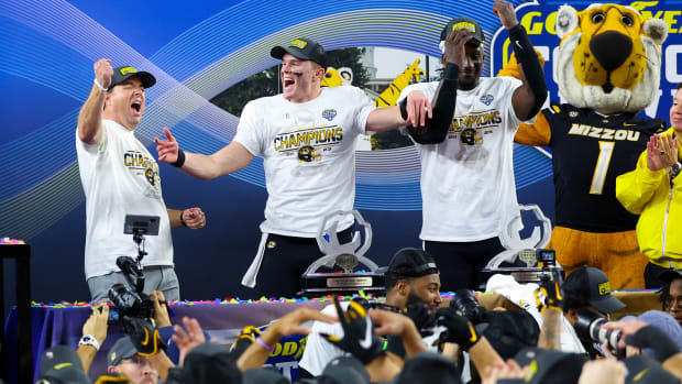 Dec 29, 2023; Arlington, TX, USA; Missouri Tigers head coach Eliah Drinkwitz and Missouri Tigers quarterback Brady Cook (12) and Missouri Tigers defensive lineman Johnny Walker Jr. (15) celebrate after the game against the Ohio State Buckeyes at AT&T Stadium.