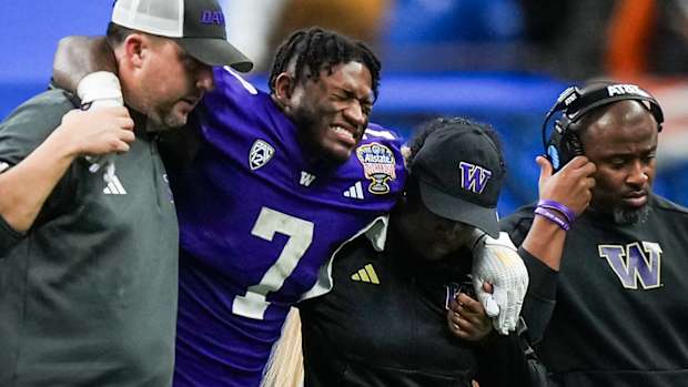 Washington Huskies running back Dillon Johnson (7) comes out of the game with an injury in the fourth quarter against the Texas Longhorns in the 2024 Sugar Bowl.