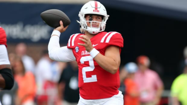Ole Miss Rebels quarterback Jaxson Dart looks downfield during a college football game in the SEC.