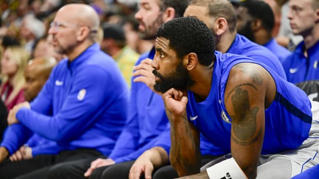 Dallas Mavericks guard Kyrie Irving (11) on the bench against the Utah Jazz during the second half at the Delta Center.