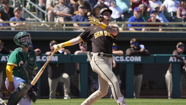 Mar 12, 2023; Mesa, Arizona, USA; San Diego Padres shortstop Jackson Merrill (77) hits against the Oakland Athletics in the second inning at Hohokam Stadium. Mandatory Credit: Rick Scuteri-USA TODAY Sports  