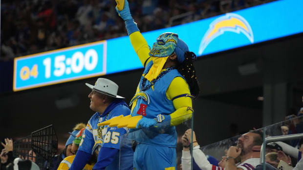 Dec 23, 2023; Inglewood, California, USA; A Los Angeles Chargers fan in a costume reacts during the game against the Buffalo Bills at SoFi Stadium. Mandatory Credit: Kirby Lee-USA TODAY Sports  