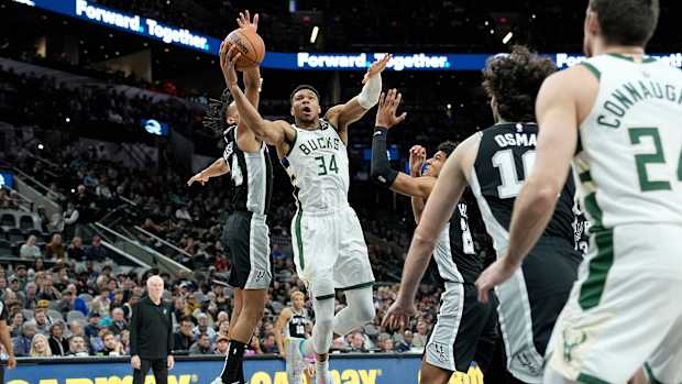 Jan 4, 2024; San Antonio, Texas, USA; Milwaukee Bucks forward Giannis Antetokounmpo (34) between San Antonio Spurs forward Dom Barlow (26) and guard Devin Vassell (24) during the first half at Frost Bank Center.