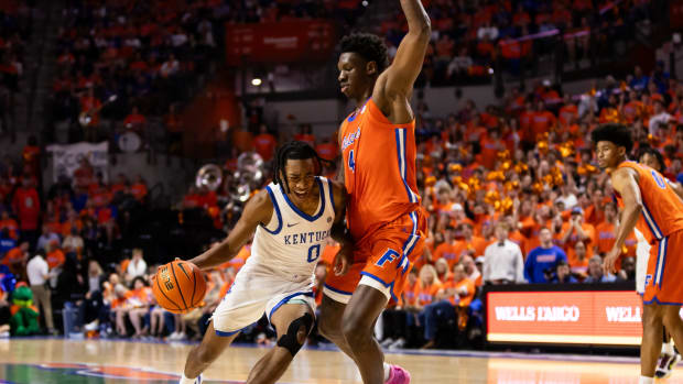 Jan 6, 2024; Gainesville, Florida, USA; Kentucky Wildcats guard Rob Dillingham (0) moves to the basket against Florida Gators forward Tyrese Samuel (4) during the first half at Exactech Arena at the Stephen C. O'Connell Center. Mandatory Credit: Matt Pendleton-USA TODAY Sports