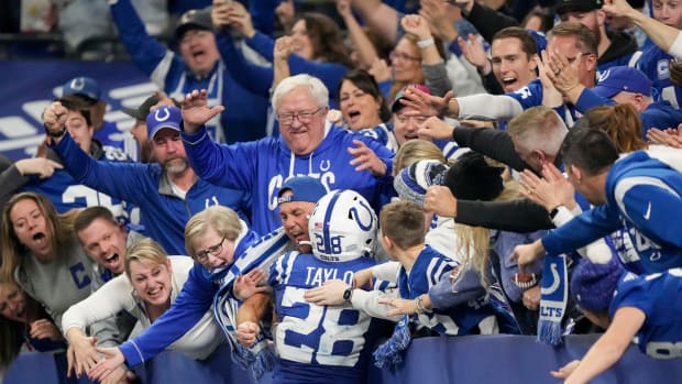 Indianapolis Colts running back Jonathan Taylor (28) celebrates with fans after rushing for a touchdown Saturday, Jan. 6, 2024, during a game against the Houston Texans at Lucas Oil Stadium in Indianapolis.  