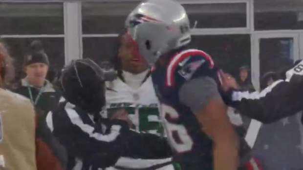 Patriots’ Pharaoh Brown battles to the sideline.