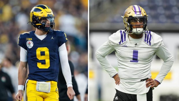 J.J. McCarthy stands looking to the side; Michael Penix Jr. Stands with his hands on his hips