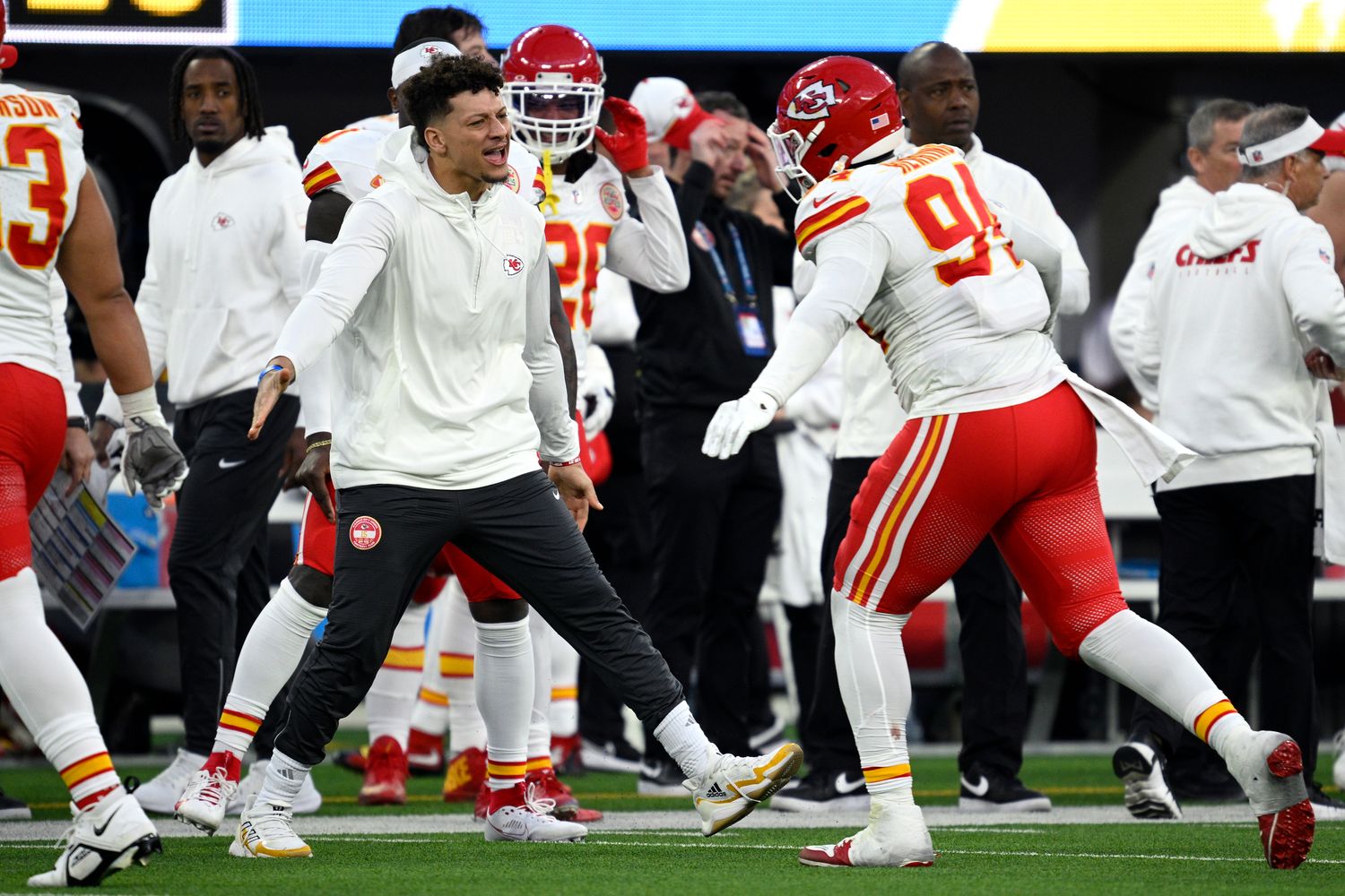 Jan 7, 2024; Inglewood, California, USA; Kansas City Chiefs quarterback Patrick Mahomes (left) celebrates with defensive end Malik Herring (94) during the second half against the Los Angeles Chargers at SoFi Stadium. Mandatory Credit: Orlando Ramirez-USA TODAY Sports  