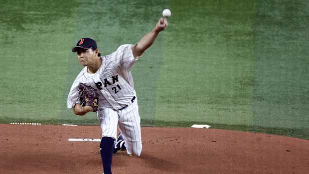 Mar 21, 2023; Miami, Florida, USA; Japan starting pitcher Shota Imanaga (21) pitches against the USA in the first inning at LoanDepot Park. Mandatory Credit: Rhona Wise-USA TODAY Sports  