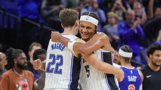 Dec 29, 2023; Orlando, Florida, USA; Orlando Magic forward Franz Wagner (22) and forward Paolo Banchero (5) celebrate their 117-108 win against the New York Knicks at KIA Center.