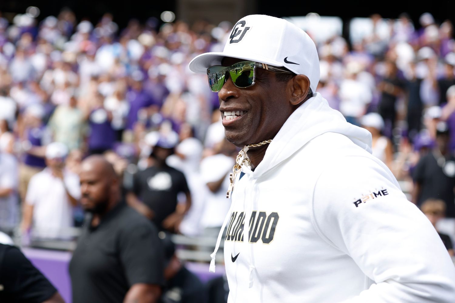 Sep 2, 2023; Fort Worth, Texas, USA; Colorado Buffaloes head coach Deion Sanders runs on the field before the game against the TCU Horned Frogs at Amon G. Carter Stadium