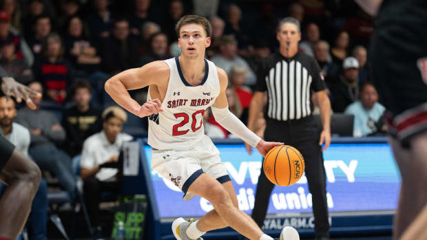 St. Mary's Gaels guard Aidan Mahaney (20) controls the ball during the second half against the Utah Utes at University Credit Union Pavilion on November 27, 2023.
