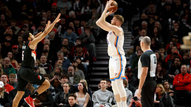 Nov 19, 2023; Portland, Oregon, USA; Oklahoma City Thunder forward Davis Bertans (9) shoots over Portland Trail Blazers guard Skylar Mays (5) in the first half at Moda Center.