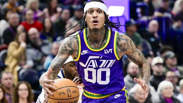 Jan 10, 2024; Salt Lake City, Utah, USA; Denver Nuggets forward/guard Justin Holiday (9) reaches for the ball by Utah Jazz guard Jordan Clarkson (00) during the second half at the Delta Center.