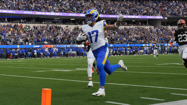 Puka Nacua runs toward the end zone for a touchdown against the Browns