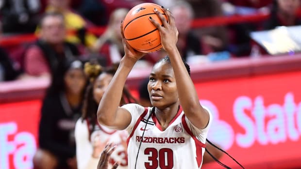 Razorbacks' Maryam Dauda puts up a shot down low against Mississippi State
