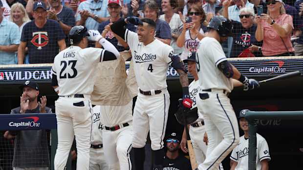 Oct 3, 2023; Minneapolis, Minnesota, USA; Minnesota Twins short stop Royce Lewis (23) celebrates with shortstop Carlos Correa after hitting a home run in the third inning against the Toronto Blue Jays during game one of the Wildcard series for the 2023 MLB playoffs at Target Field.