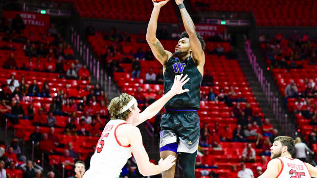 Dec 31, 2023; Salt Lake City, Utah, USA; Washington Huskies forward Keion Brooks Jr. (1) shoots over Utah Utes center Branden Carlson (35) during the second half at the the Jon M. Huntsman Center. Mandatory Credit: Christopher Creveling-USA TODAY Sports