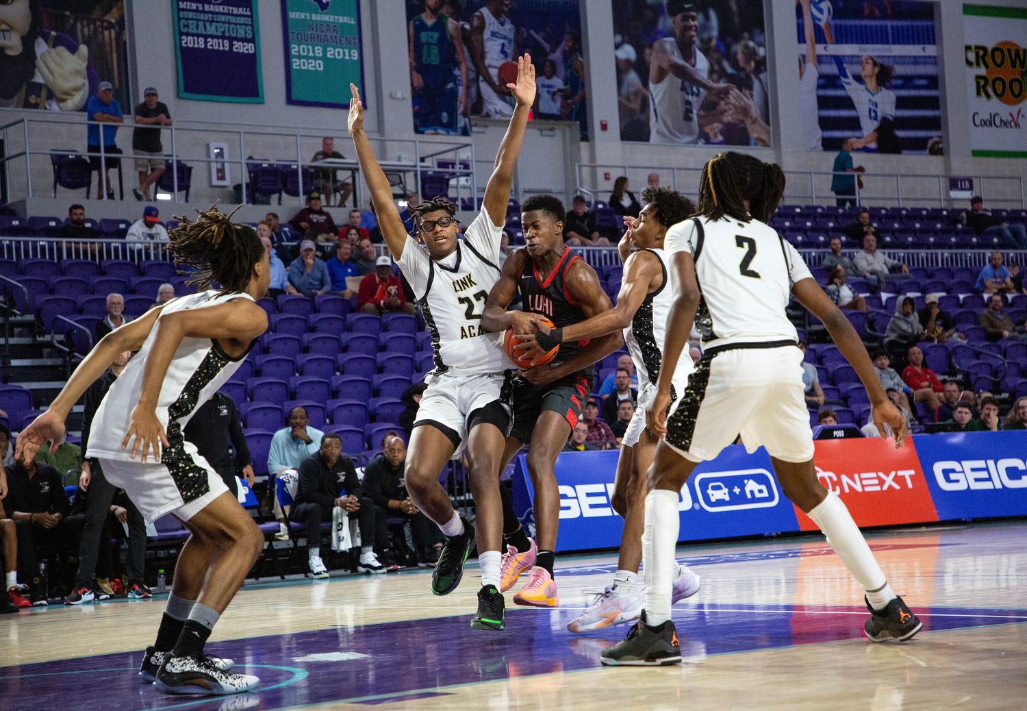 VJ Edgecombe of Long Island Lutheran is surrounded by Link Academy defenders in the second semifinal matchup in the City of Palms Classic on Friday, Dec. 22, 2023 at Suncoast Credit Union Arena in Fort Myers.